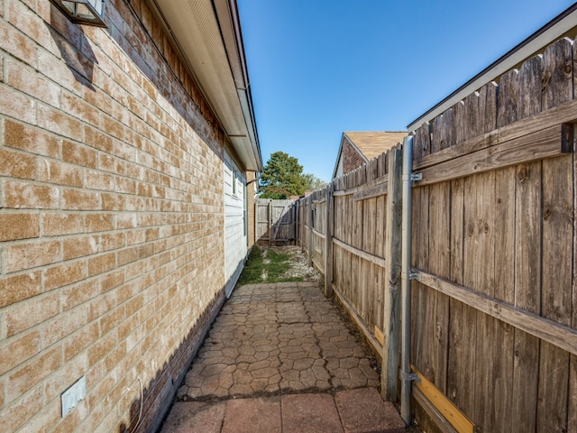 view of side of home with a patio area