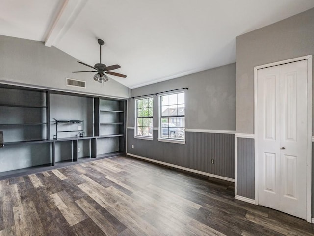 unfurnished living room with vaulted ceiling with beams, ceiling fan, dark wood-type flooring, and wood walls