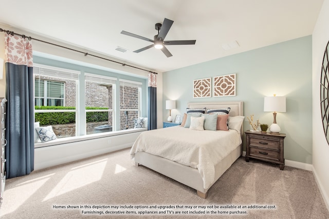 bedroom with ceiling fan and light colored carpet