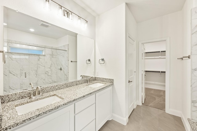 bathroom with vanity and walk in shower