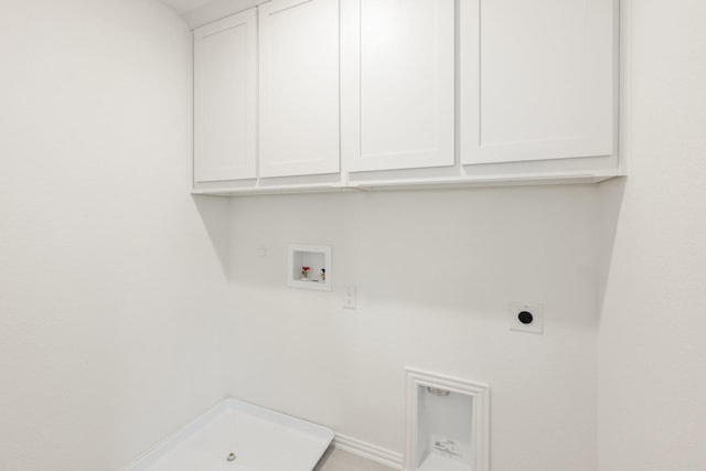 laundry area with cabinets, gas dryer hookup, electric dryer hookup, and hookup for a washing machine