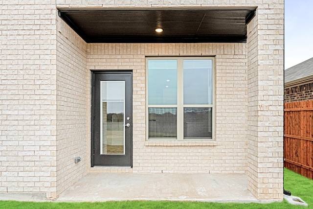 entrance to property featuring a patio area