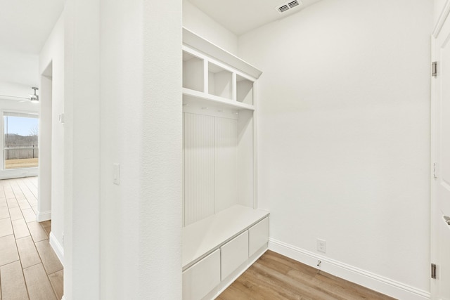 mudroom with light hardwood / wood-style flooring and ceiling fan