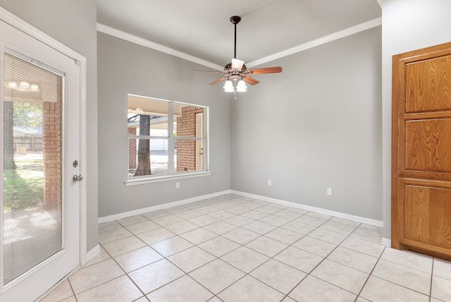 tiled empty room featuring ceiling fan and ornamental molding