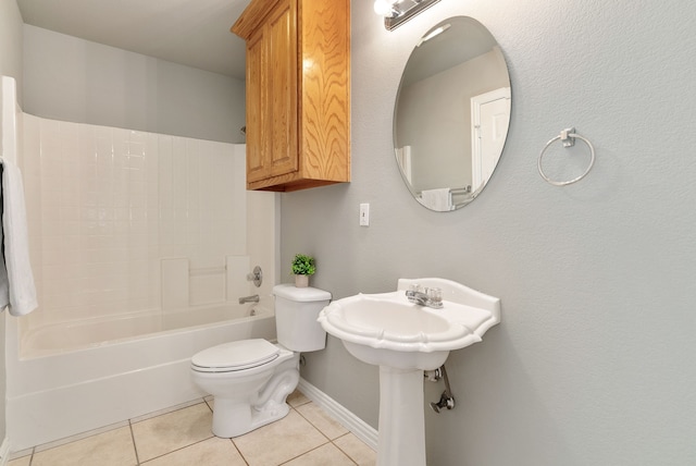 bathroom with tile patterned flooring, toilet, and tub / shower combination