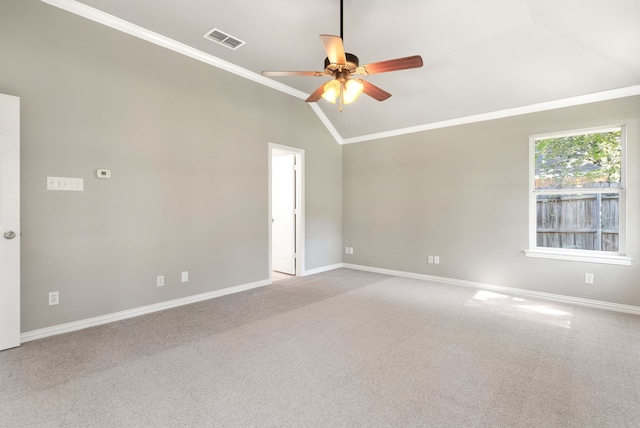 unfurnished room featuring ceiling fan, light colored carpet, lofted ceiling, and crown molding