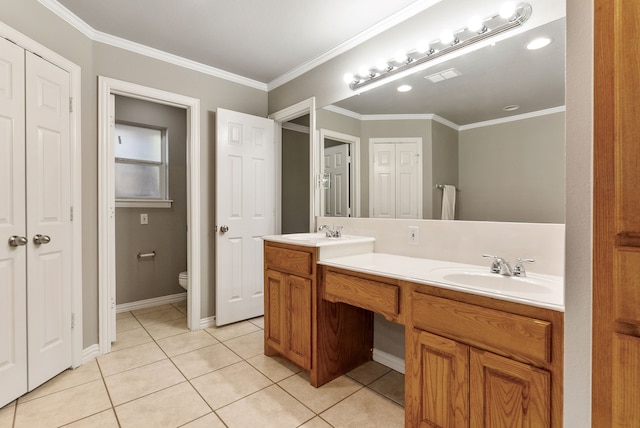 bathroom featuring crown molding, tile patterned flooring, vanity, and toilet