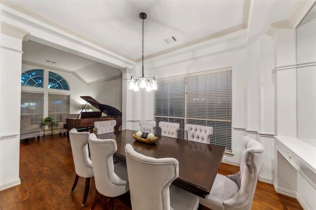 dining area featuring a chandelier, lofted ceiling, crown molding, and dark wood-type flooring