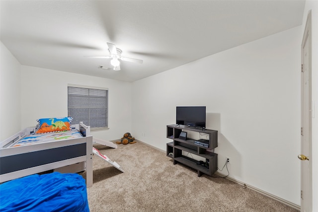 bedroom featuring ceiling fan and carpet floors