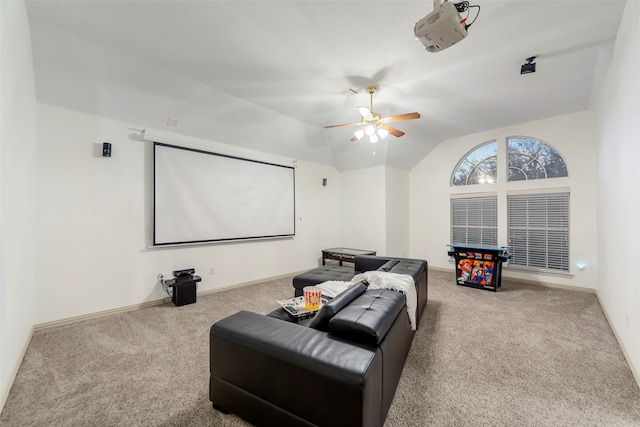 cinema with carpet floors, vaulted ceiling, and ceiling fan