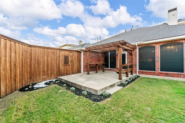 back of house featuring a lawn, a patio, and a pergola