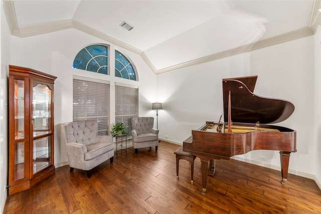 sitting room with hardwood / wood-style floors, vaulted ceiling, and crown molding