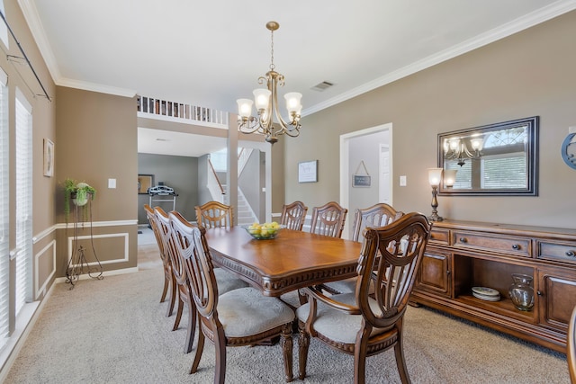 dining room with ornamental molding, a wealth of natural light, and light carpet