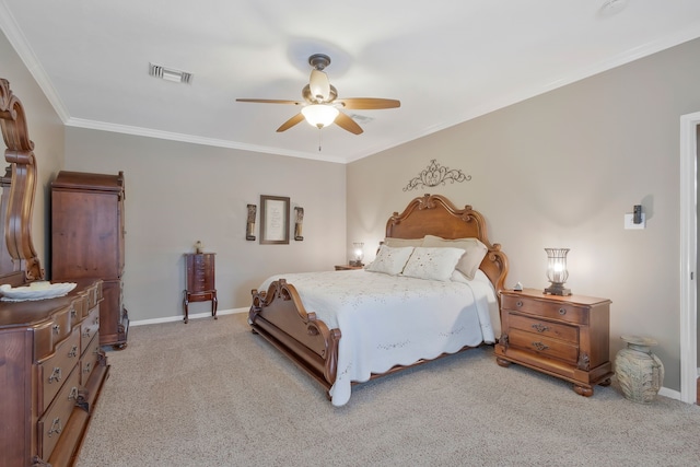 carpeted bedroom featuring ceiling fan and crown molding