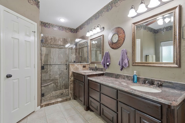 8525 Castle Creek Rd, North Richland Hills, TX 76182 - bathroom featuring a stall shower, double vanity, tile patterned floors, and ceiling fan