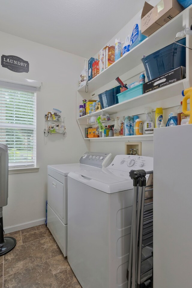 clothes washing area with washer and dryer