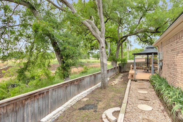 view of yard featuring a gazebo and a deck