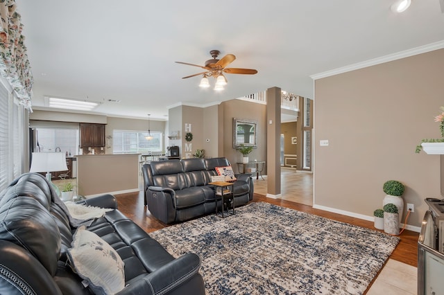 8525 Castle Creek Rd, North Richland Hills, TX 76182 - living room featuring ceiling fan, crown molding, baseboards, and light wood finished floors