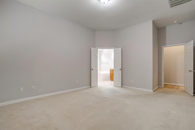 unfurnished bedroom featuring light colored carpet