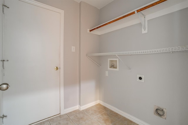 laundry area with hookup for a washing machine, light tile patterned floors, and electric dryer hookup