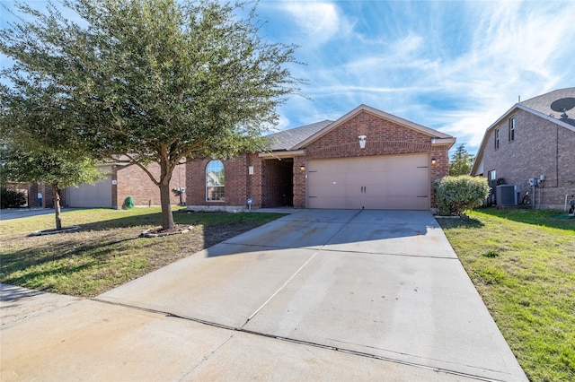 view of front of property featuring cooling unit, a garage, and a front lawn