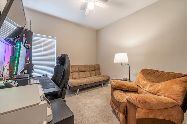 carpeted office space with ceiling fan