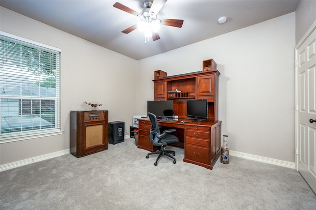 carpeted home office featuring a wealth of natural light and ceiling fan