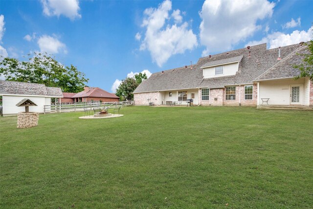 view of yard with an outdoor fire pit