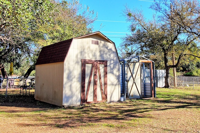 view of outbuilding with a lawn