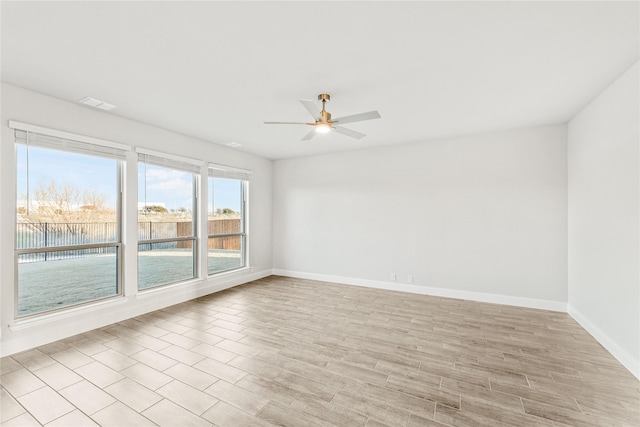 empty room featuring ceiling fan