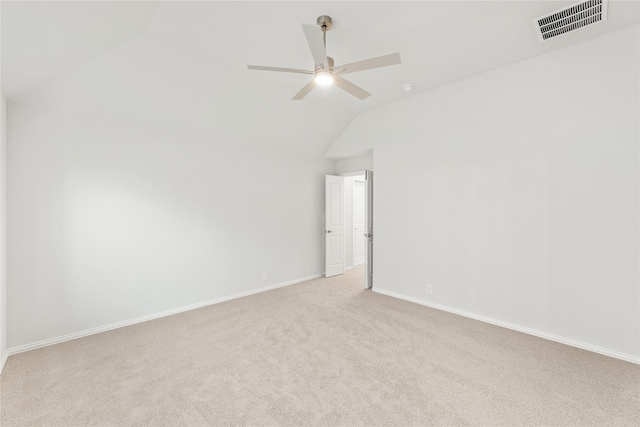 carpeted spare room with ceiling fan and lofted ceiling