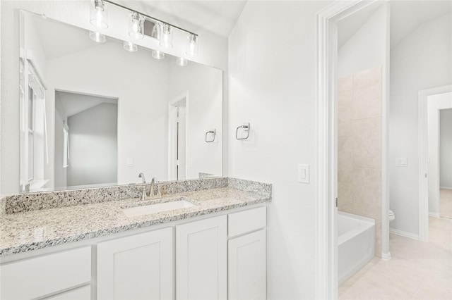 full bathroom with vanity, tiled shower / bath, tile patterned floors, and toilet