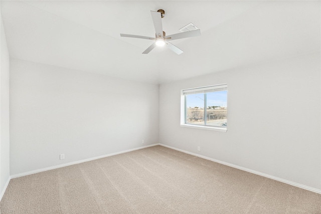 empty room with ceiling fan and carpet floors