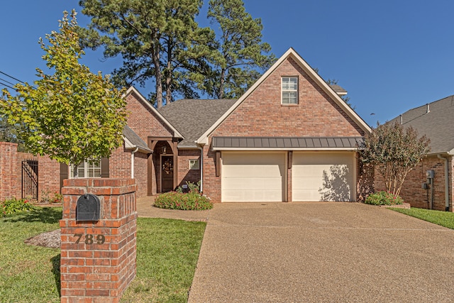 view of front facade with a front lawn and a garage