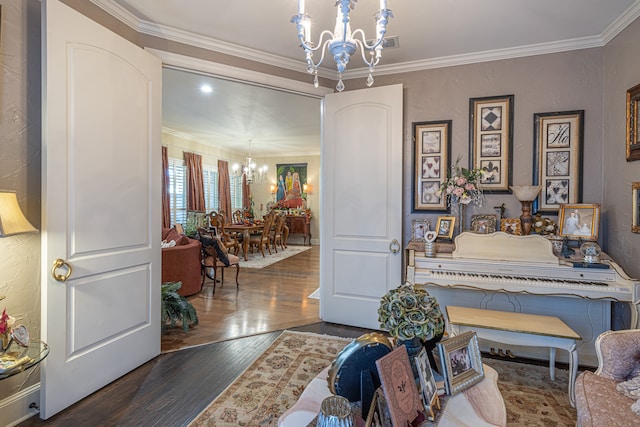 interior space with dark hardwood / wood-style floors, crown molding, and a notable chandelier