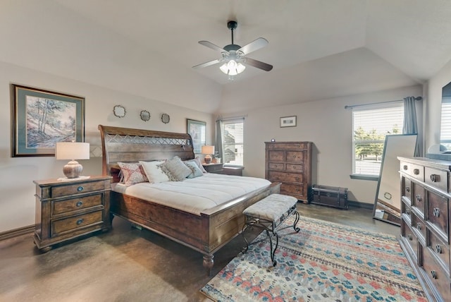 bedroom featuring finished concrete floors, multiple windows, and vaulted ceiling