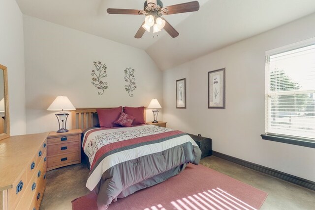 bedroom with ceiling fan, baseboards, and vaulted ceiling