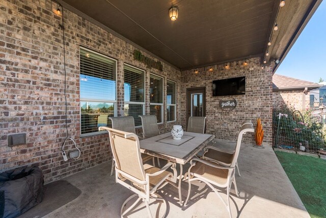 view of patio with outdoor dining area