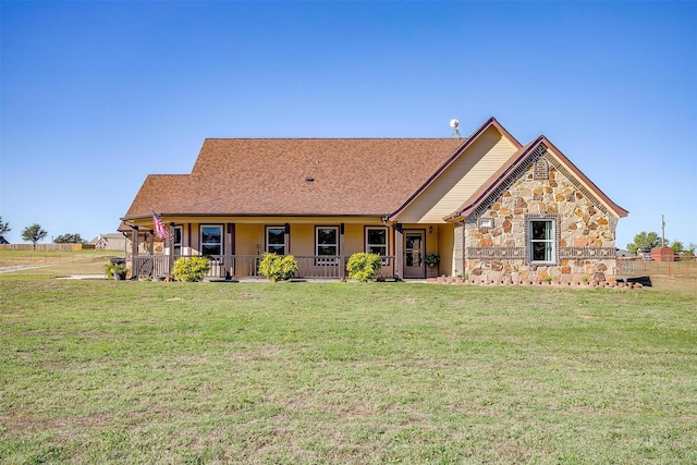 view of front of house featuring a front lawn and covered porch