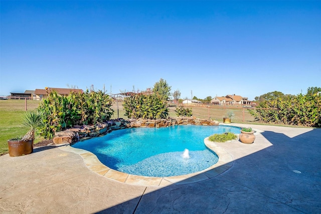 view of swimming pool with a patio area and pool water feature