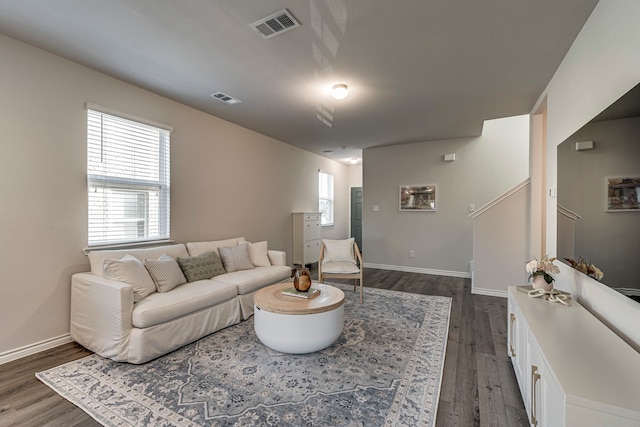 living room with dark hardwood / wood-style floors