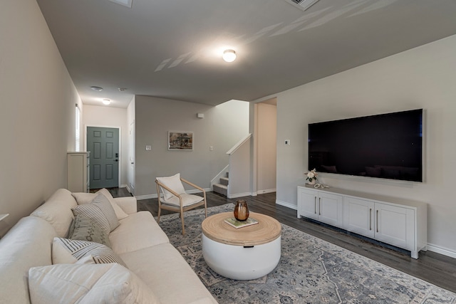 living room featuring dark hardwood / wood-style floors