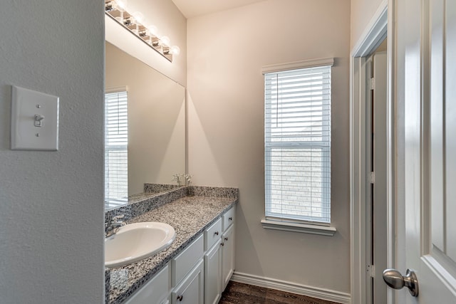 bathroom featuring vanity and wood-type flooring