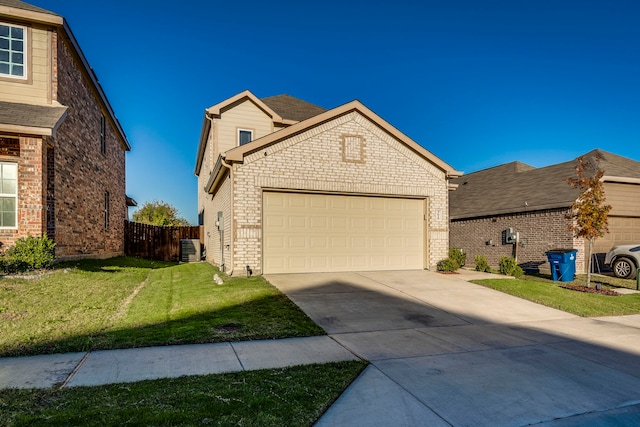 view of front of home featuring a front yard, a garage, and cooling unit