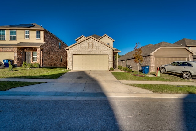 view of front of house featuring a front yard and a garage