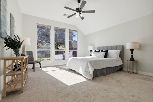 carpeted bedroom with ceiling fan and lofted ceiling