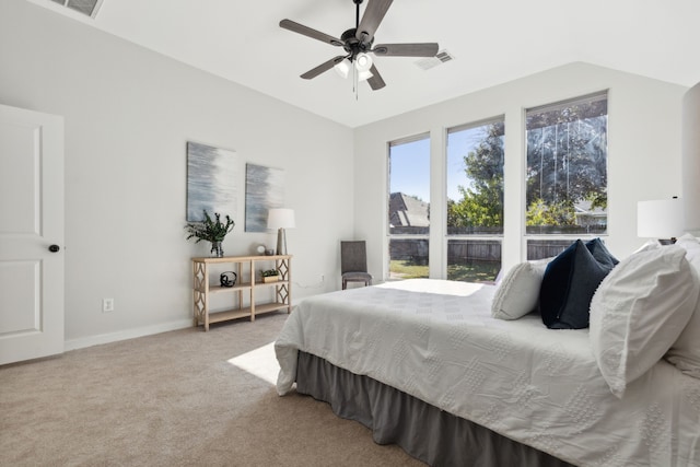 carpeted bedroom featuring vaulted ceiling and ceiling fan