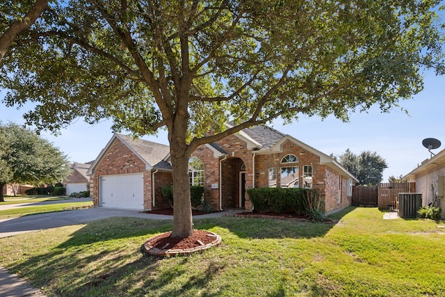 ranch-style home with central air condition unit, a front yard, and a garage