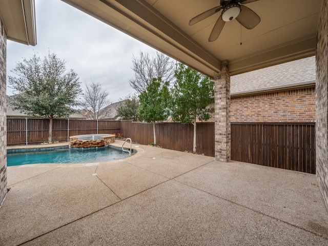 view of swimming pool featuring ceiling fan, a patio area, and an in ground hot tub