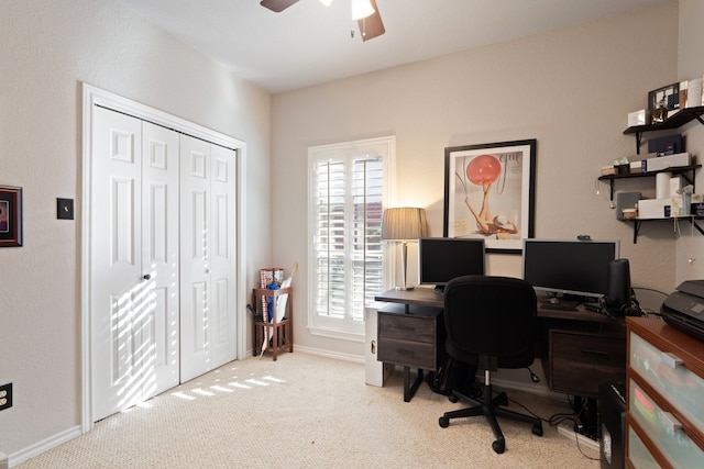 office area featuring ceiling fan and light colored carpet